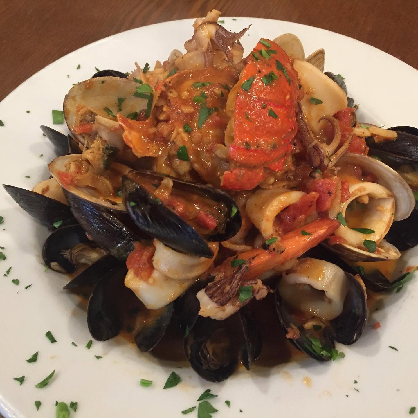 Seafood fra diavolo with clams, mussels and shrimp over linguine