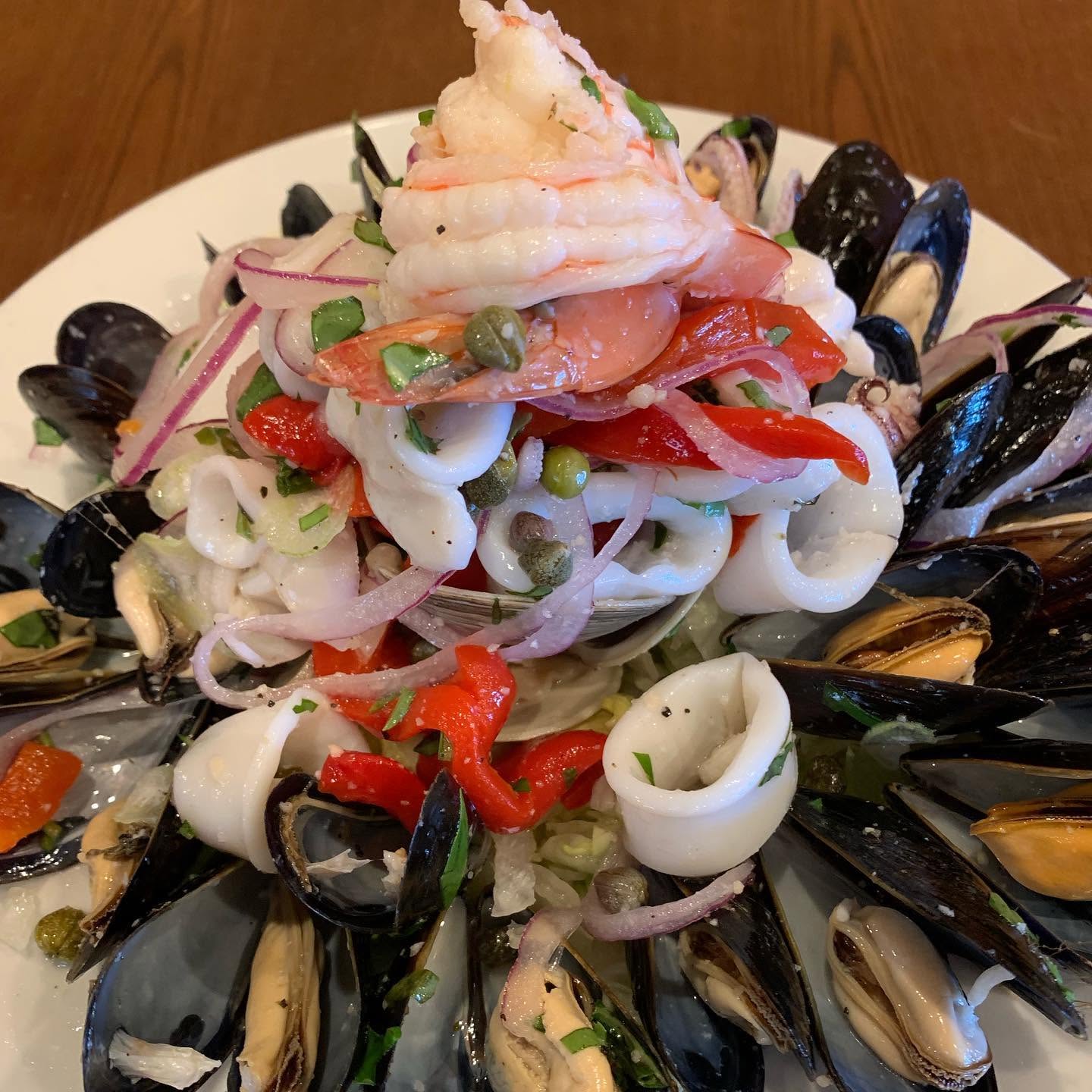 Seafood salad tower with mussels and shrimp