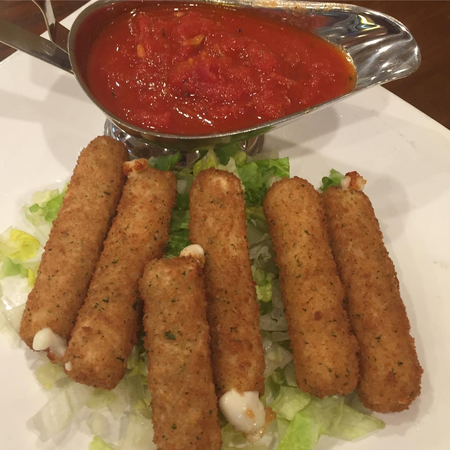 Fried mozzarella sticks with marinara dipping sauce