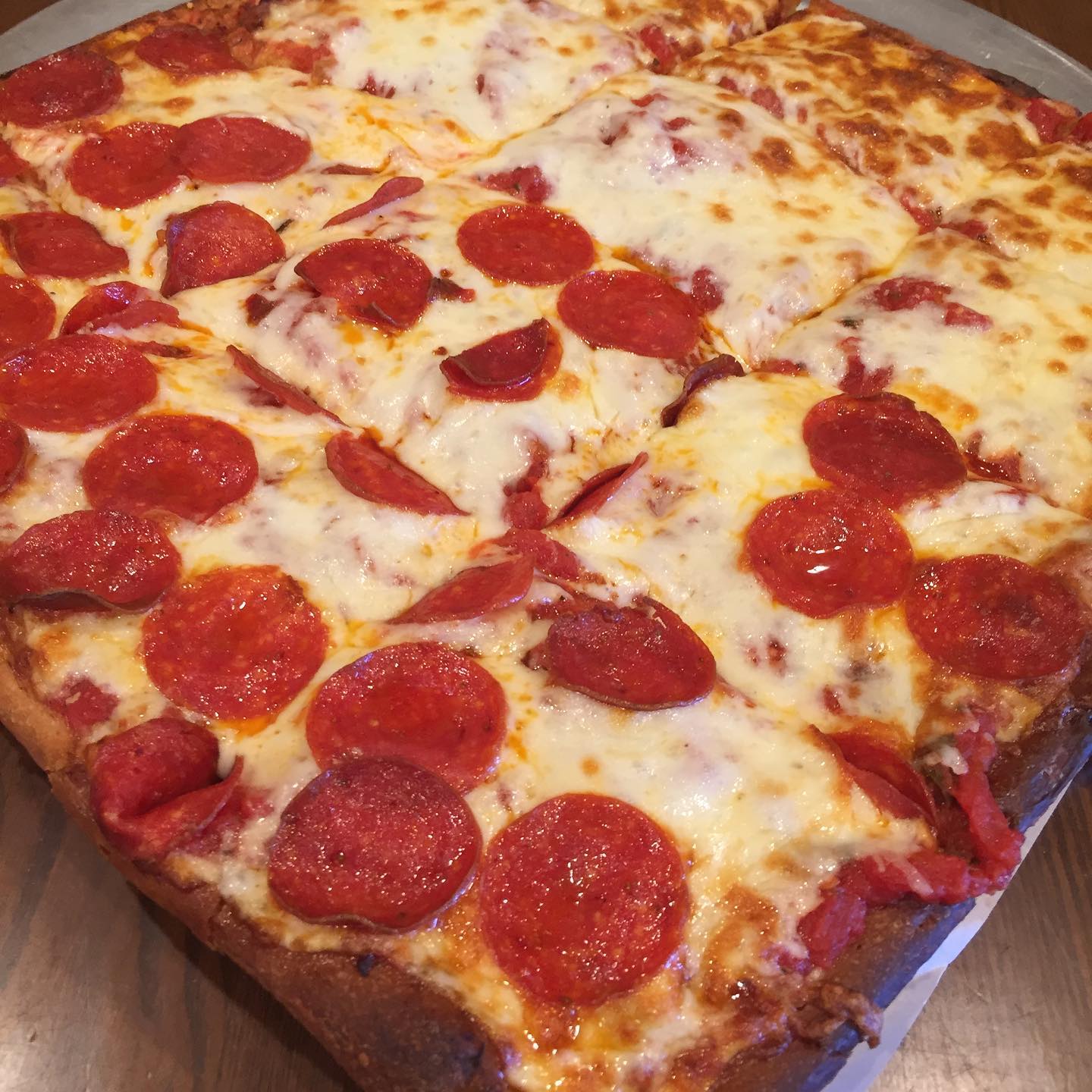 Sicilian square pizza with pepperoni and mozzarella