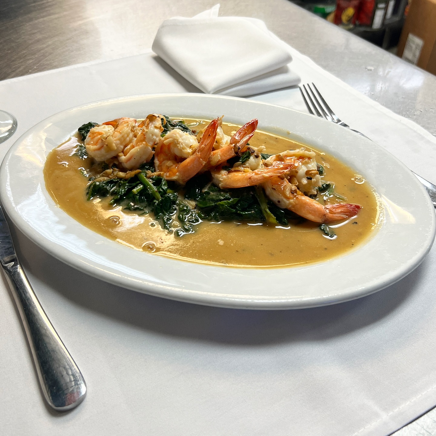 Shrimp scampi over sautéed spinach