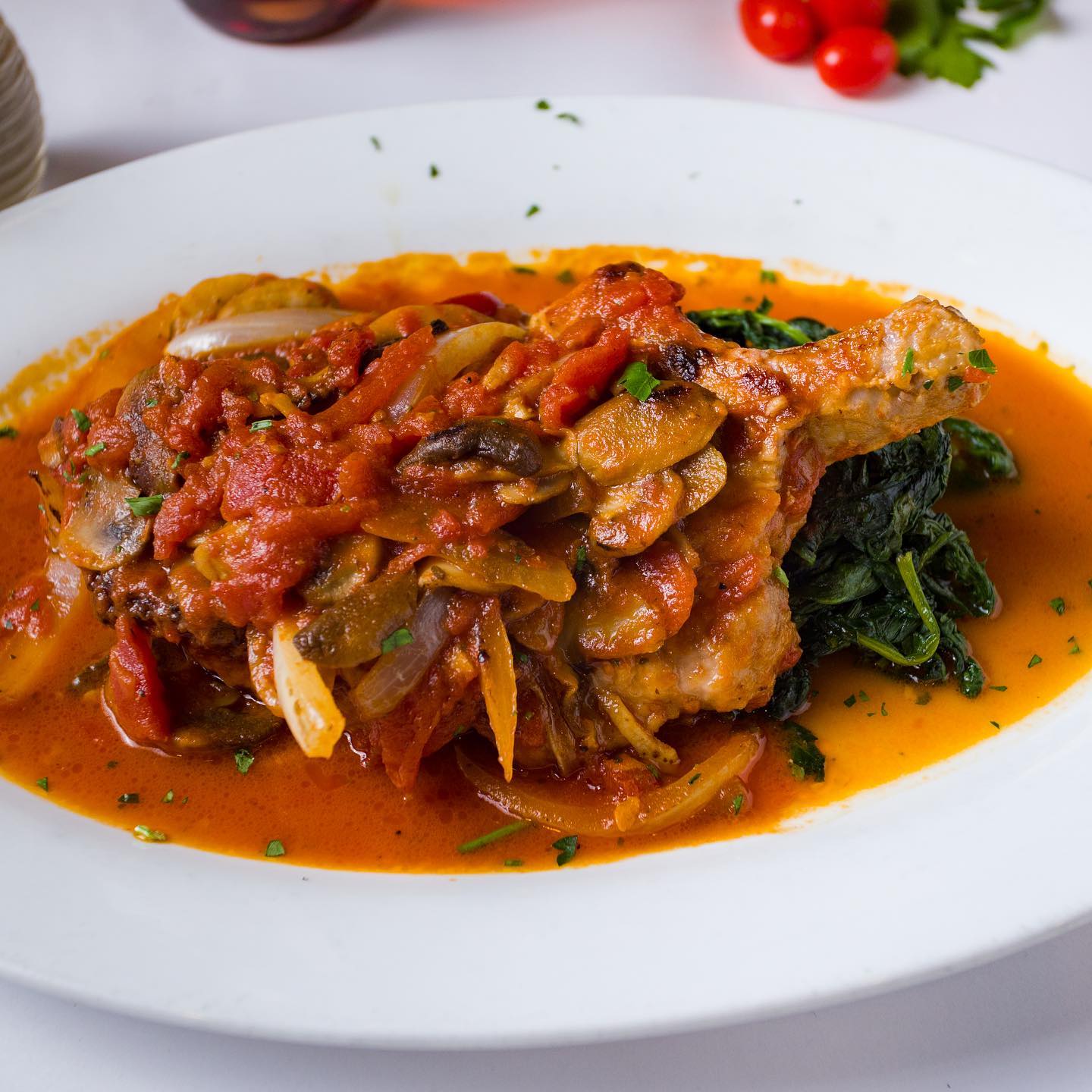 Chicken cacciatore with mushrooms, peppers, and spinach