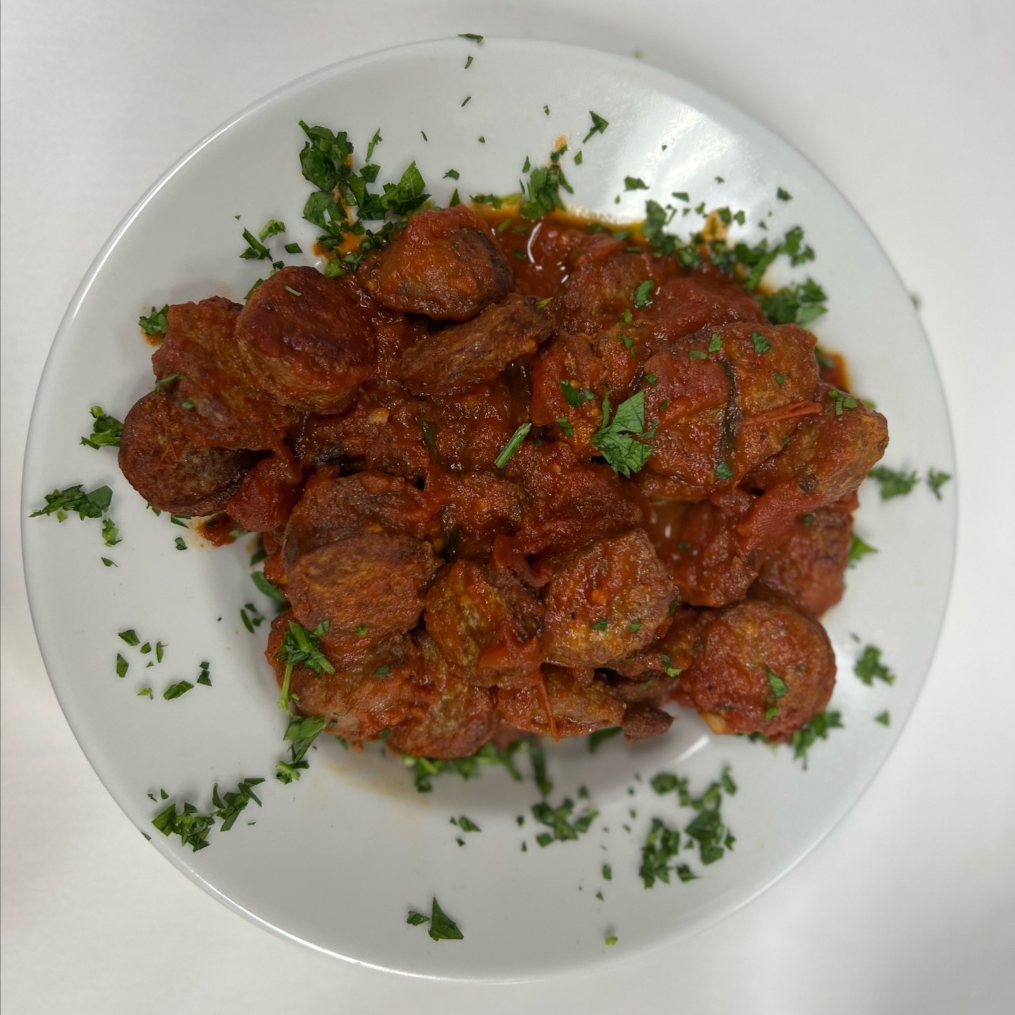 Sausage and peppers simmered in tomato sauce